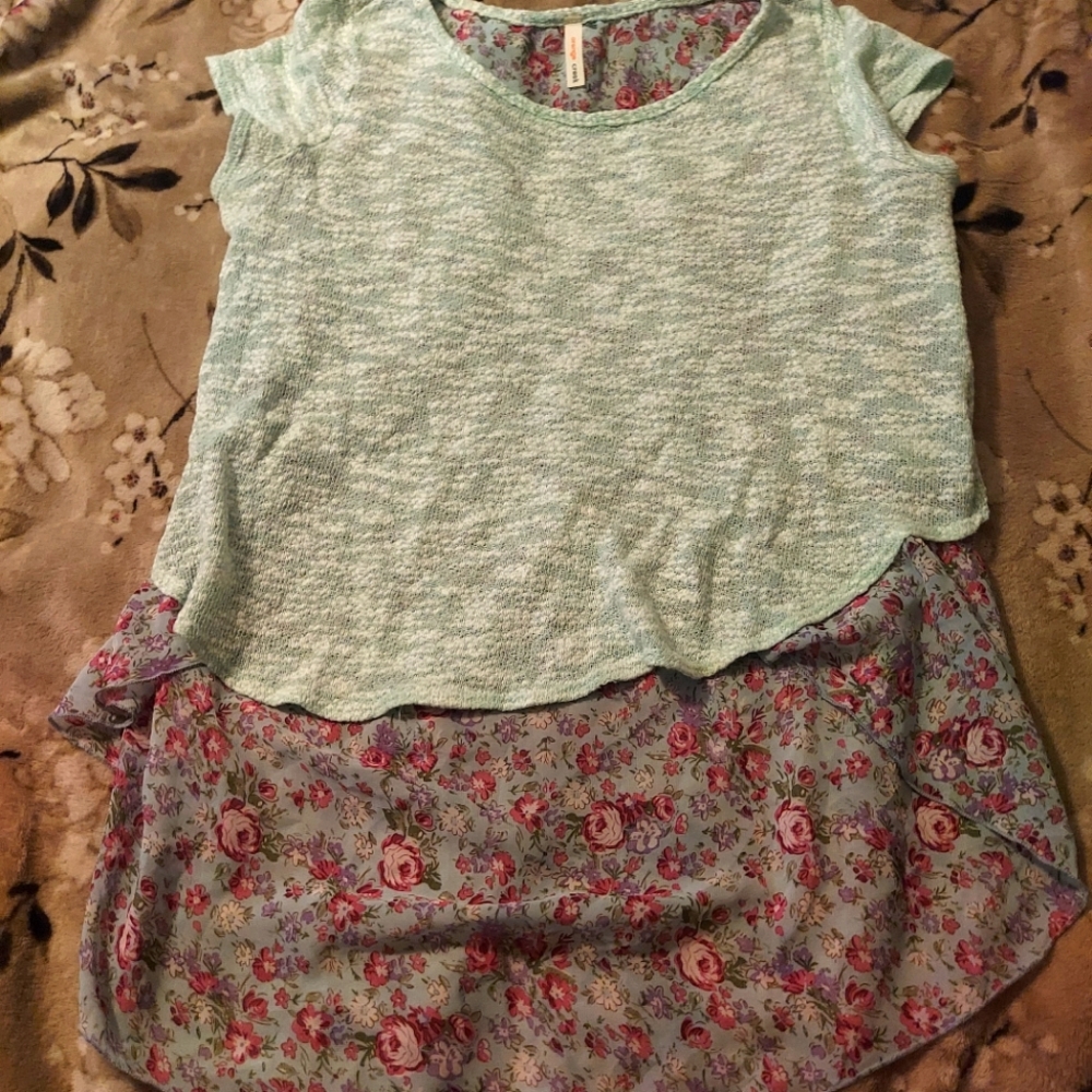 Knit shirt with sheer floral back and tie.